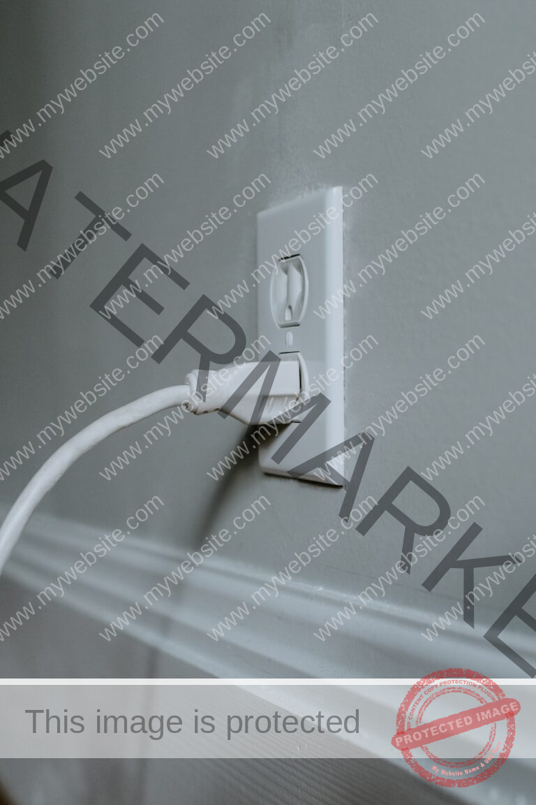 white usb cable plugged in white electric socket